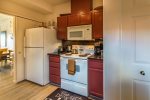 Kitchen amenities include a Refrigerator, Electric Oven and Range, Coffee Maker, Microwave, Toaster, Cookware and Blender